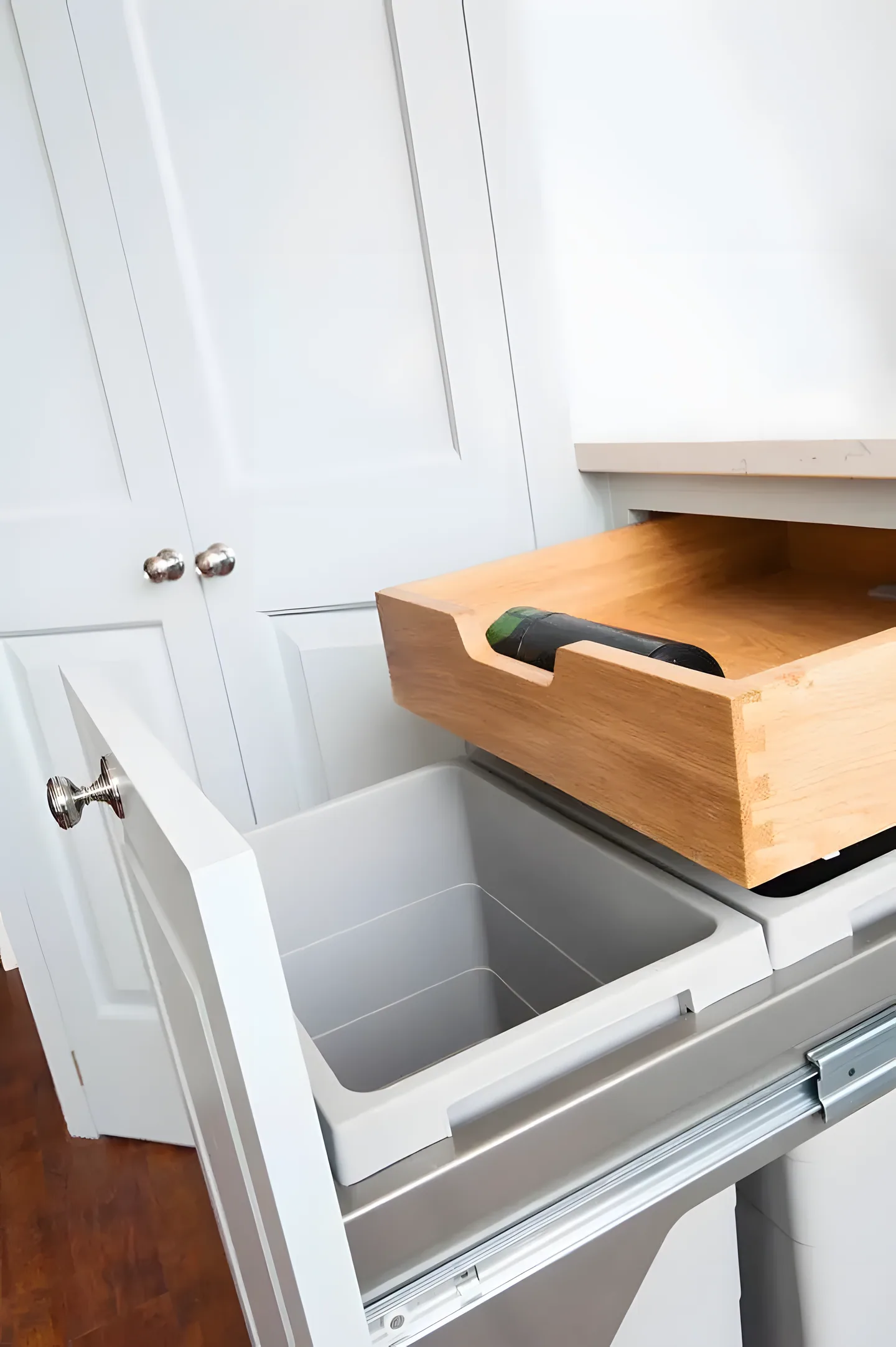 A pull-out bin drawer with an oak lid