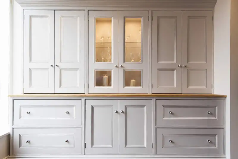 Painted glazed dresser units with an oak top